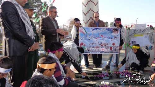 غبارروبی گلزار شهدای گمنام آزادشهر توسط دانش آموزان استثنایی این شهرستان